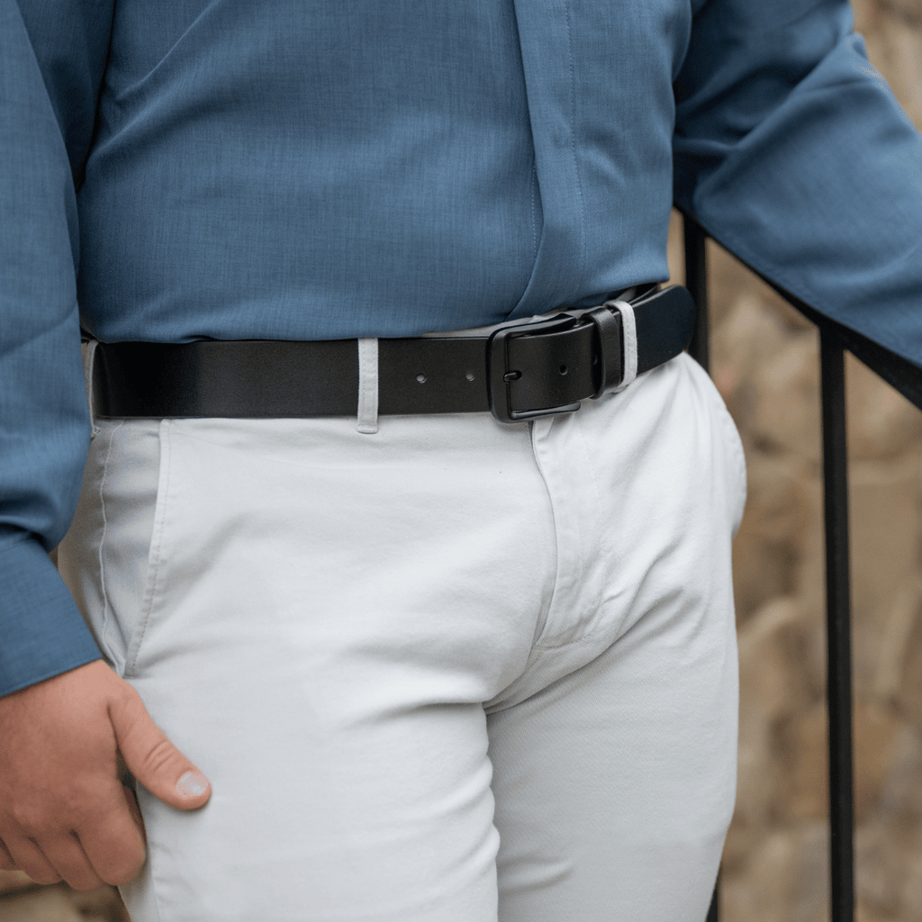 Image of Black Mountain Leather Belt on male model.  Black leather strap with black buckle