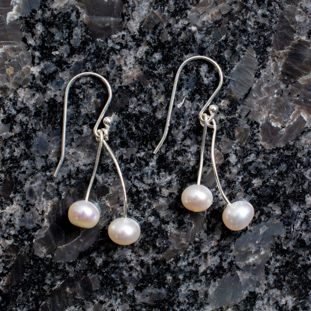 Freshwater pearl earrings. Total of 4 pearls approximate 5mm wide, Length of earrings is 3.5 mm