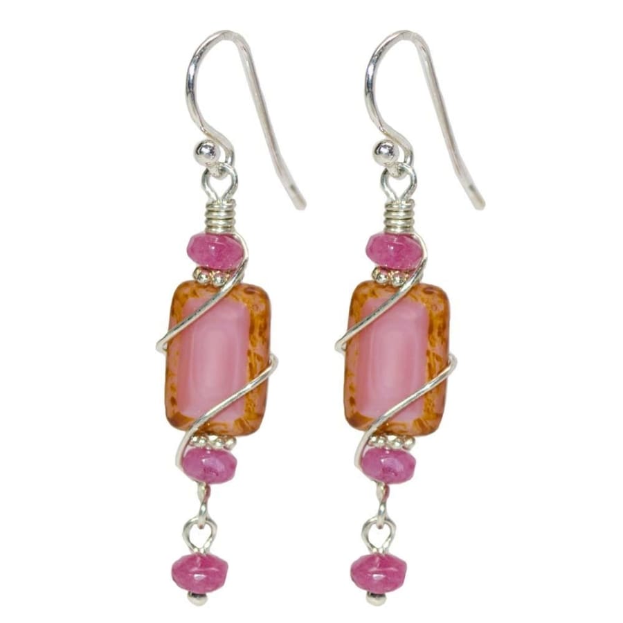 Pink rectangular glass beads accented with 3 pink beads. Silver French hooks. 1.75 inch drop