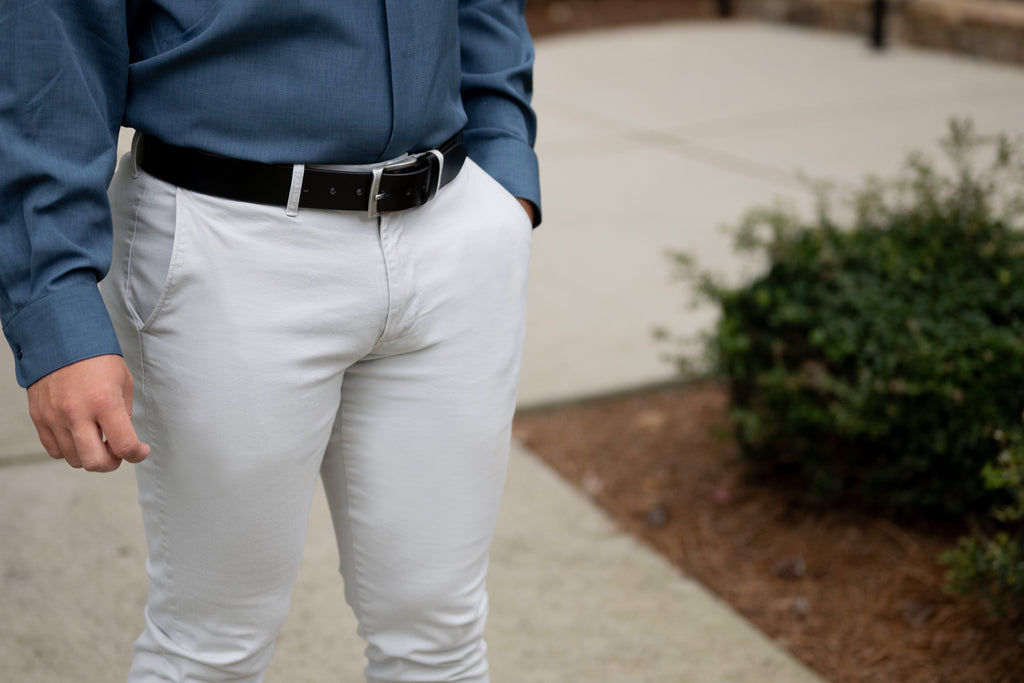 Urbanite brown and black belts against blue jeans