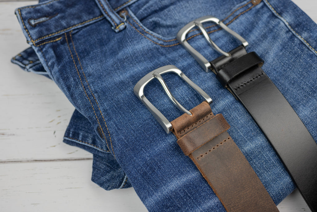 Urbanite brown and black belts against blue jeans