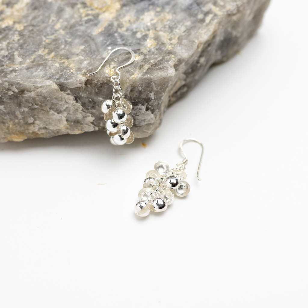 Jubilee Dangle Earrings. Dangles tinkle from sterling silver french hooks.