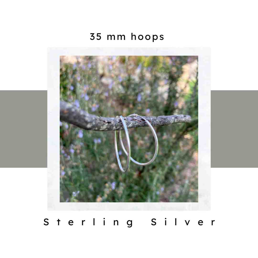 35 mm sterling silver hoop earrings by Nickel Smart on a branch. Hypoallergenic, nickel free.