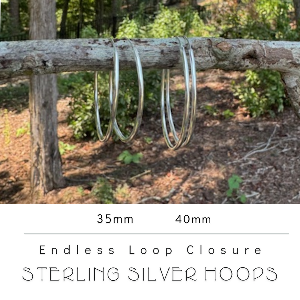 Image of 35 mm and 40 mm Sterling Silver Hoop Earrings on twig to show size comparison. Nickel Free