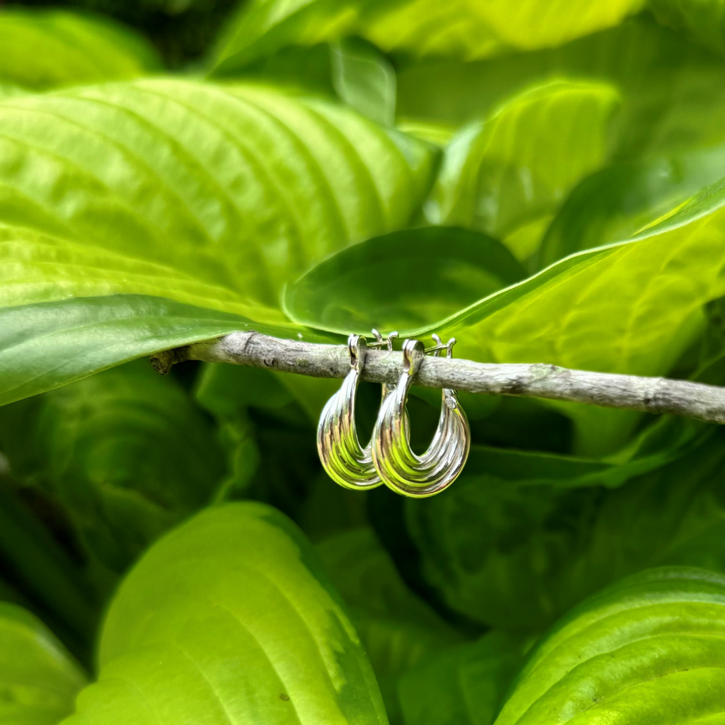 Image of sterling silver hoop earrings on a stick. 15 mm wide outside diameter. Hypoallergenic