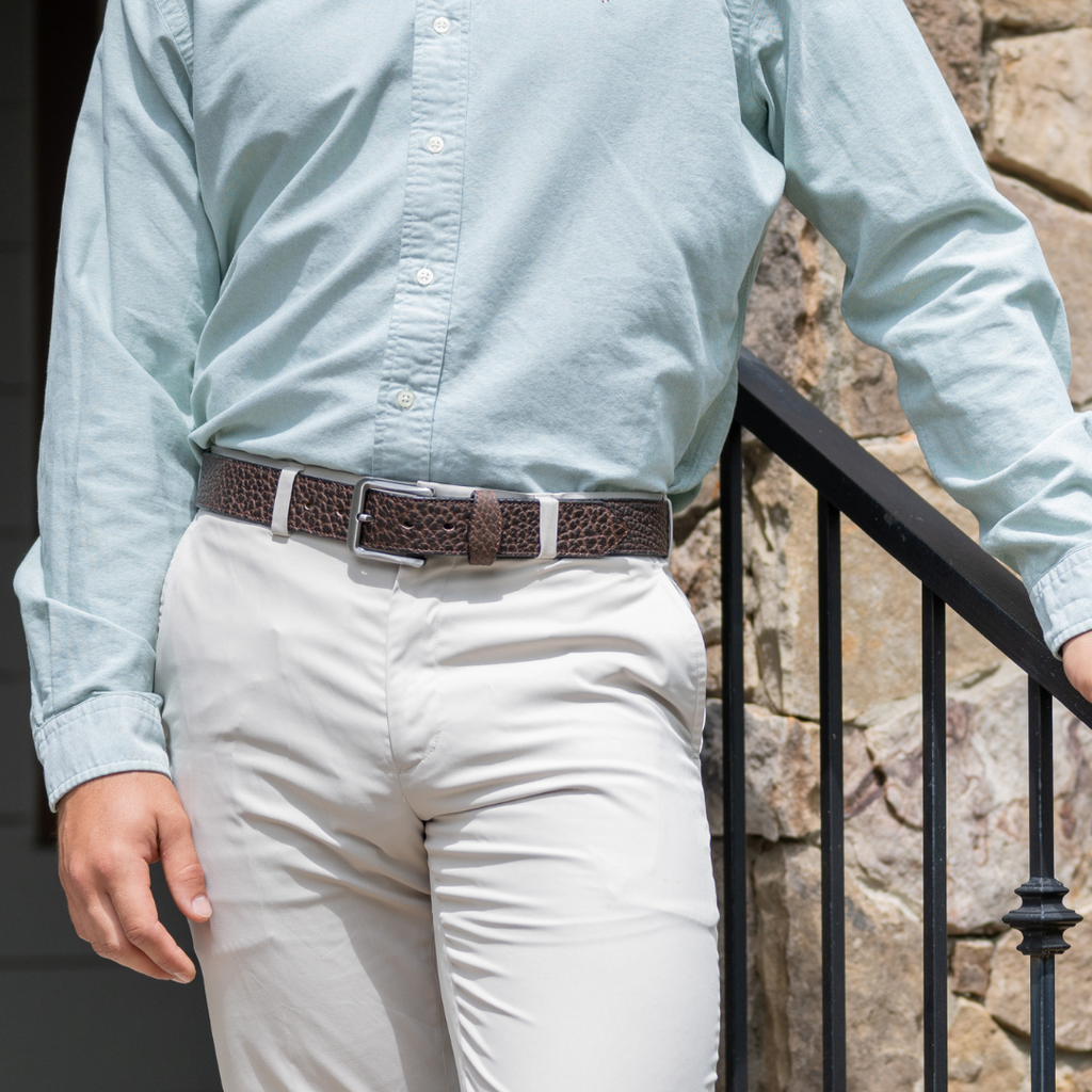 Model wearing Austin Brown Bison Leather Belt with khakis. Dress-casual belt with stylized keeper