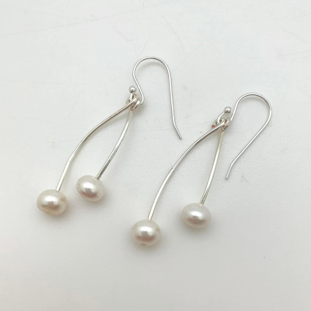 Twinleaf Freshwater Pearls Dangle Earrings. Each earring has 2 pearls on independent swinging wires.