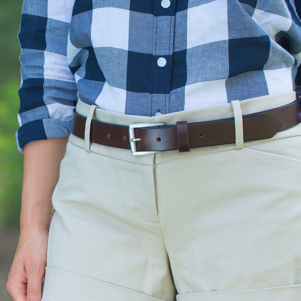 Avery Brown Belt on model. Glossy brown leather strap, black edges, dress-casual look with khakis