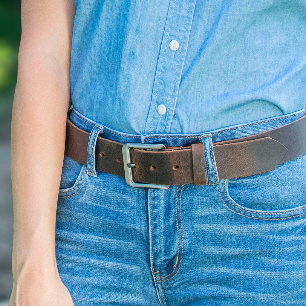Roan Mountain Distressed Leather Belt on female model. Casual distressed leather; silvery buckle.