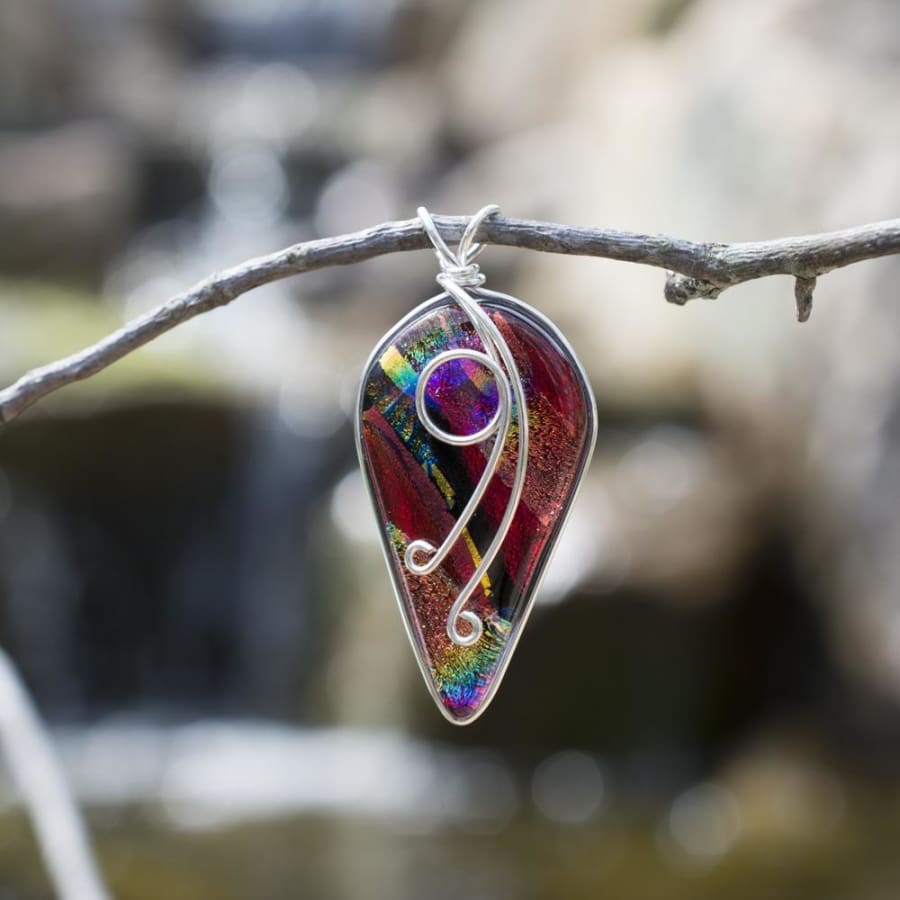 Red Dichroic glass pendant with nickel free silver wrap on front which turns into loop for chain