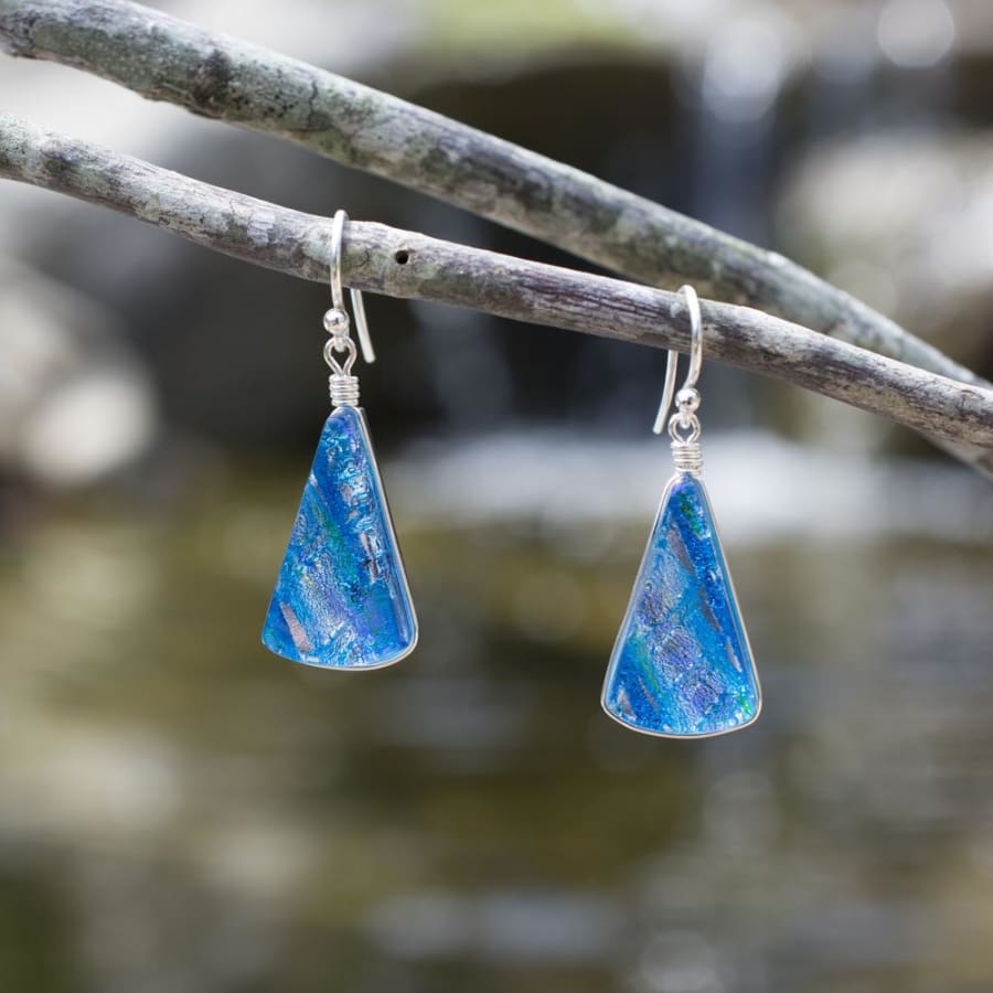 Blue and silver dichroic glass in fan shape. 1.5 inch drop earrings with silver French hook.